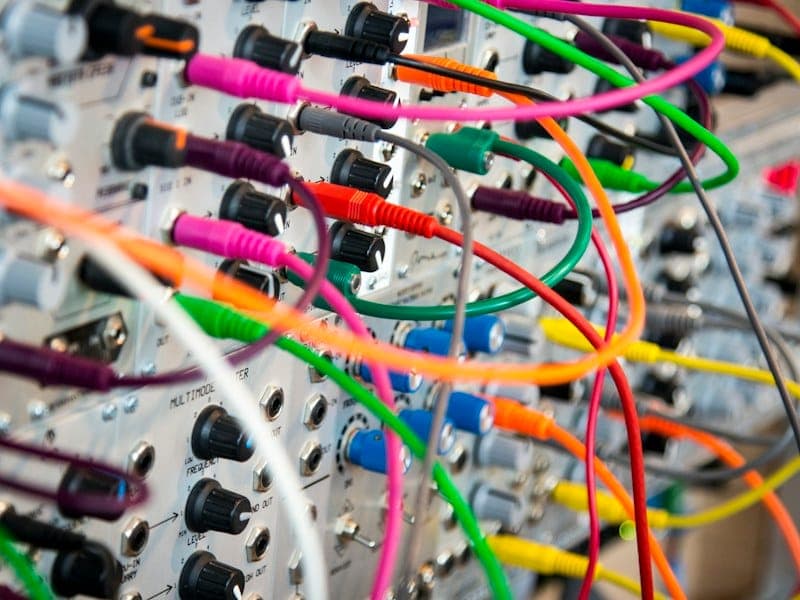 Finished cable assemblies laid out for continuity and insulation testing before packing.